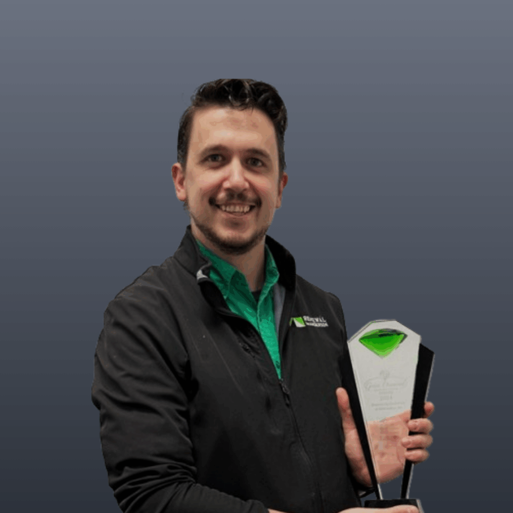 Seth Eastman holding the green diamond trophy